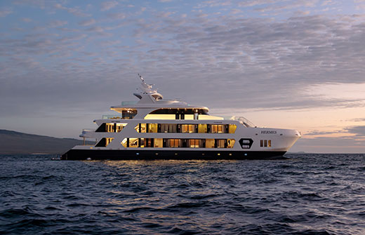 The Hermes Superyacht at sunset, a premium vessel option for a private Galapagos charter.
