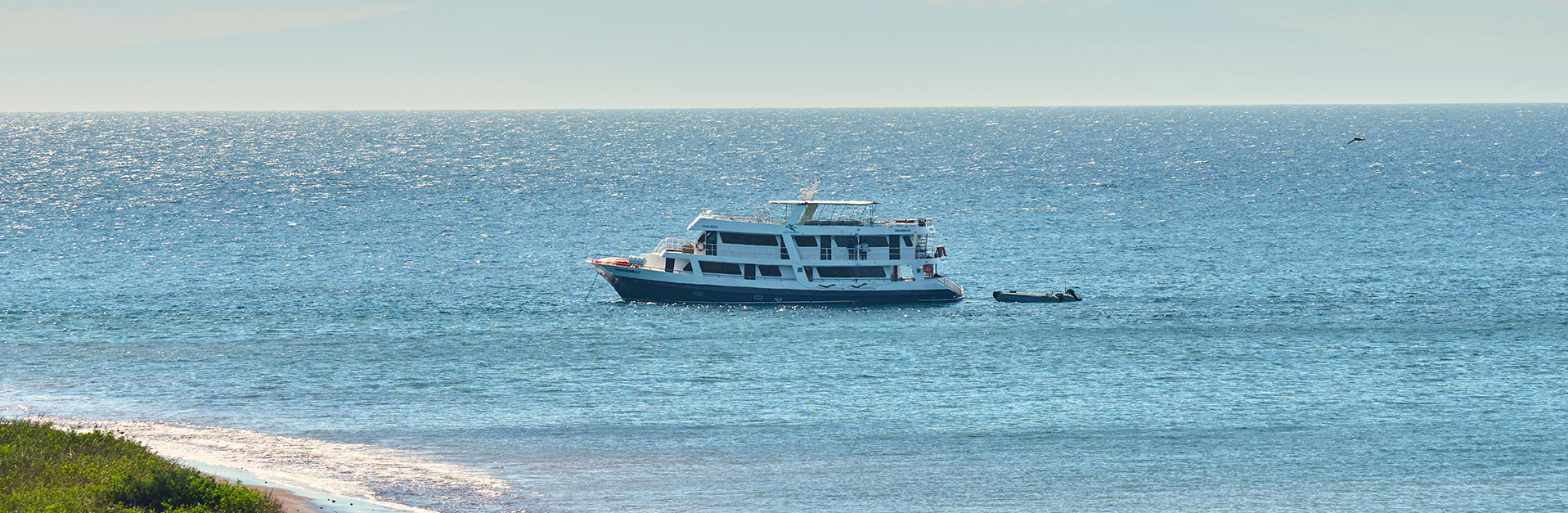 The Monserrat Yacht sailing in turquoise waters, offering the best Galapagos cruise experience.