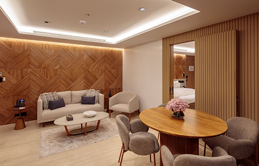 Interior view of the 775 sq. ft. Owner’s Suite, featuring a private living area and high-end design on an ultra-luxury cruise.