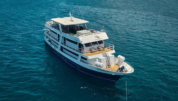 Exterior view of First Class Monserrat Yacht sailing through the Galapagos Islands.