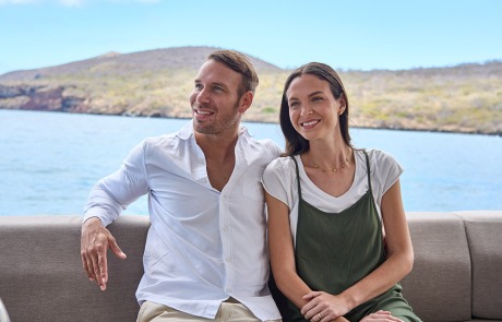A guest preparing to board or disembark from the Monserrat Yacht in the Galapagos Islands.
