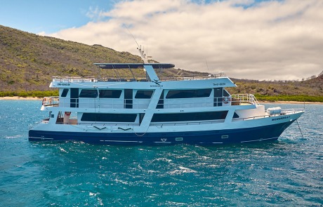 Detailed side view of the Monserrat Yacht, emphasizing the design for a luxury Galapagos Cruise.