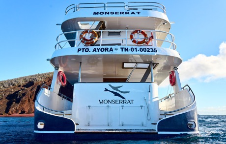 Rear view of the Monserrat Yacht navigating the beautiful Galapagos Islands.