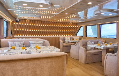 Interior of the elegant Latitude Restaurant aboard the Monserrat Yacht Galapagos Cruise.