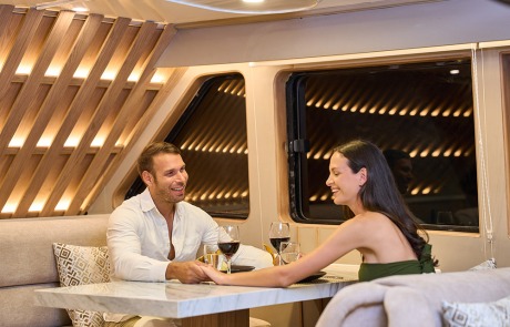 Intimate dining setting inside the Latitude Restaurant on the Monserrat Yacht.