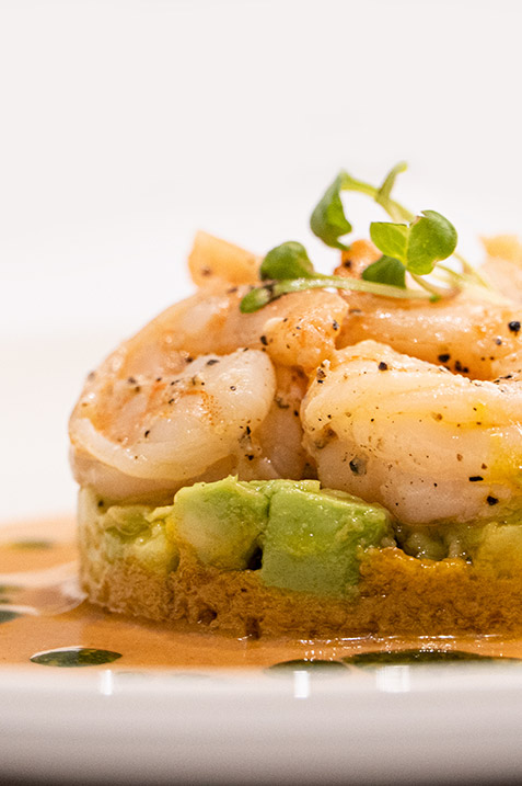 Exquisite plate featuring a fusion of local Ecuadorian and international cuisine served in the main dining area of the Hermes Galapagos Luxury Cruise.